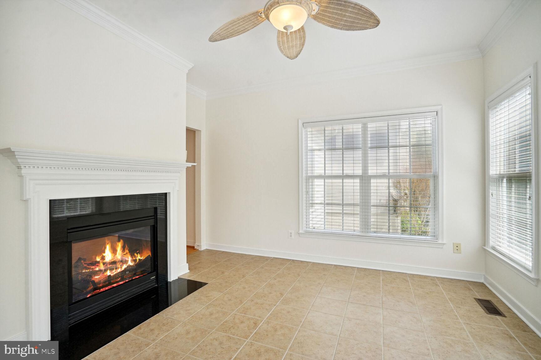 13037 Ormond Drive Bristow, VA 20136 - Photo 7 of 36 Sun room with ceiling fan & ceramic tile.