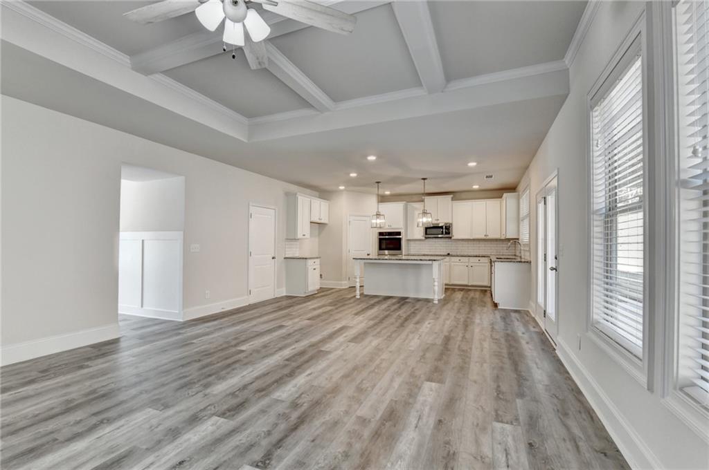 1661 Silver Crest Way Hoschton, GA 30548 - Photo 19 of 57 a view of kitchen with wooden floor
