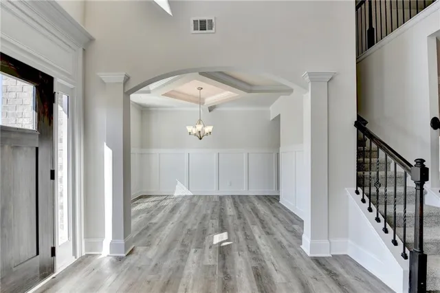 a view of hallway with wooden floor