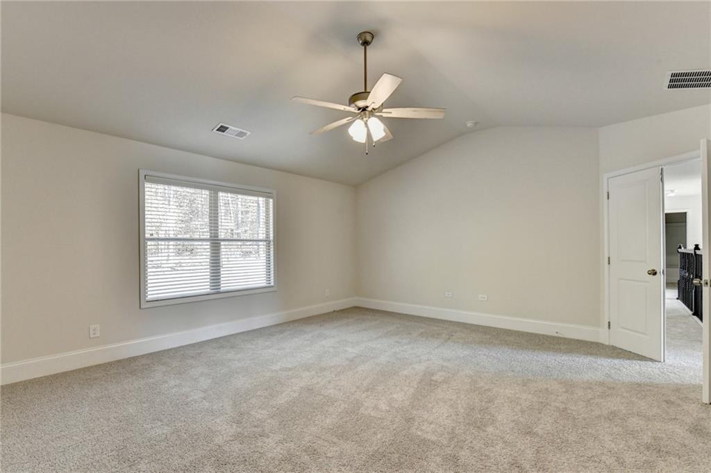 1661 Silver Crest Way Hoschton, GA 30548 - Photo 47 of 57 an empty room with windows and fan