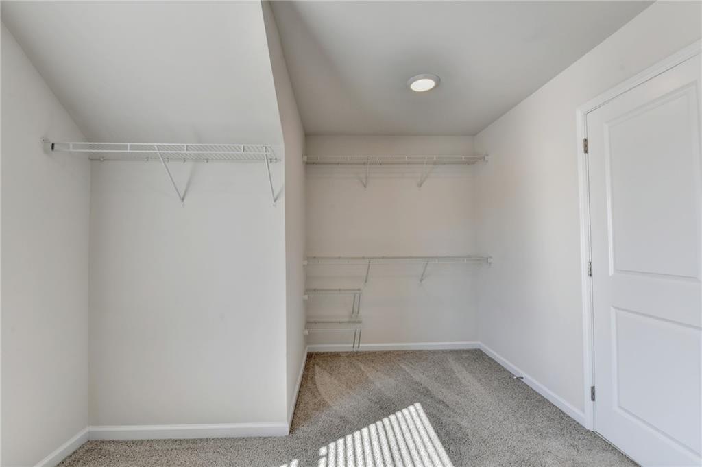 1661 Silver Crest Way Hoschton, GA 30548 - Photo 54 of 57 a view of a room with racks on the wall