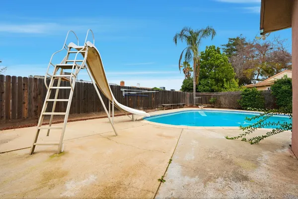 a view of a house with a swimming pool
