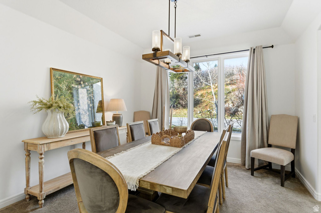 1878 East Ridge Point Drive Bountiful, UT 84010 - Photo 8 of 92 Dining space featuring carpet, suspended lighting, and lofted ceiling