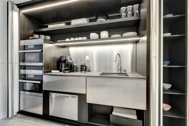 a kitchen with a table and chairs in it