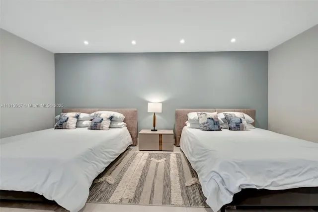 a living room with furniture and a mirror