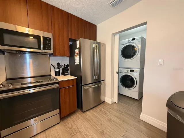 a kitchen with a stove and a microwave