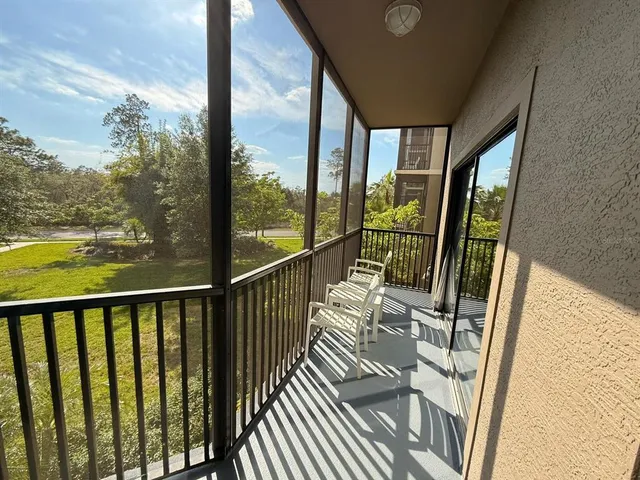 a view of balcony with wooden floor