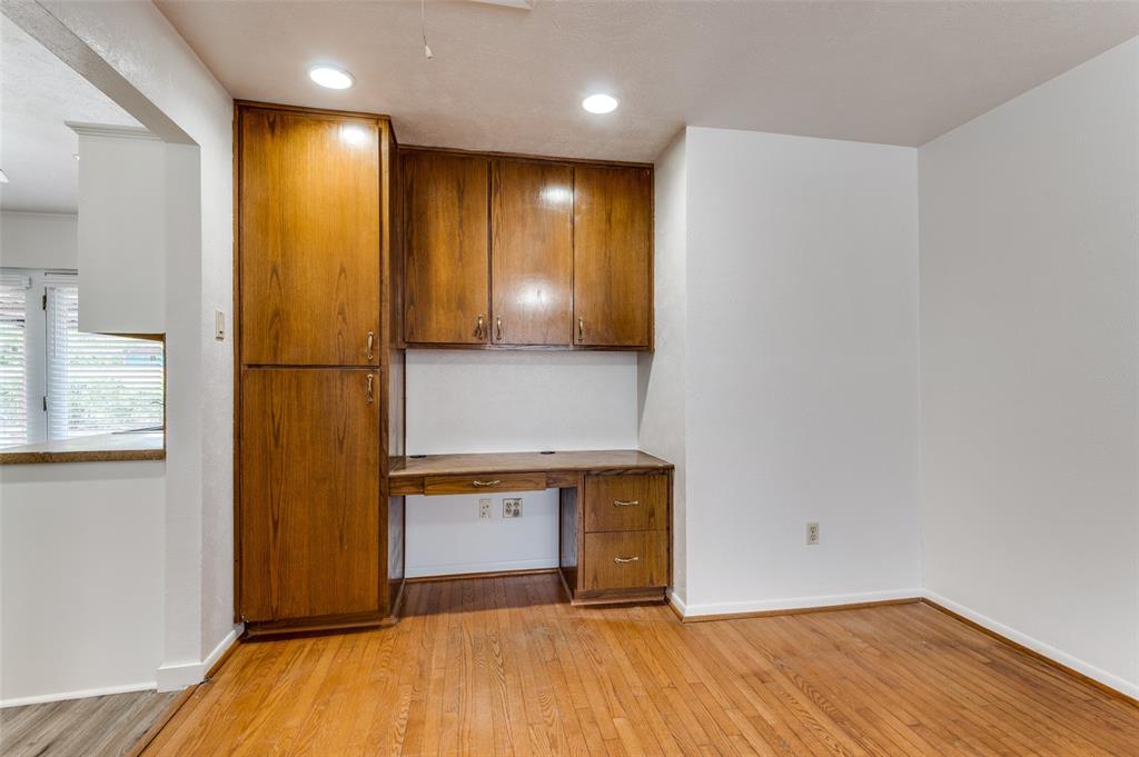 1230 Fairdale Street Irving, TX 75062 - Photo 13 of 24 Unfurnished office with light wood-style flooring, built in desk, and recessed lighting