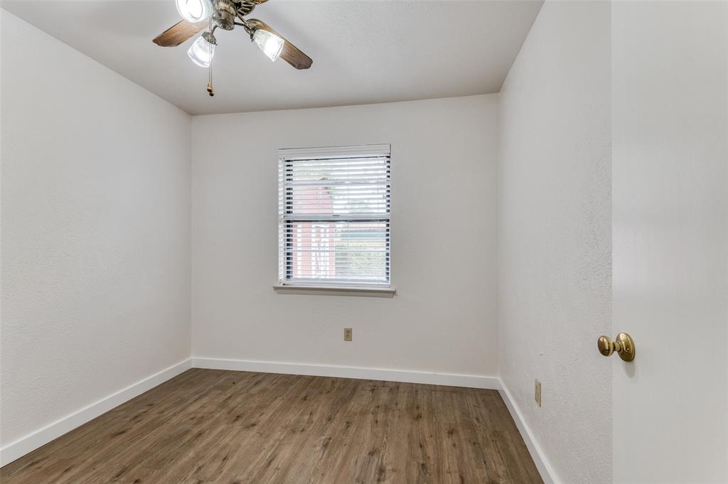 1230 Fairdale Street Irving, TX 75062 - Photo 17 of 24 Unfurnished room featuring wood finished floors and a ceiling fan
