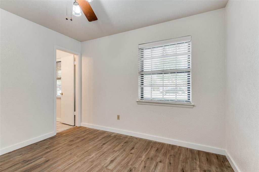 1230 Fairdale Street Irving, TX 75062 - Photo 19 of 24 Spare room with wood finished floors and a ceiling fan