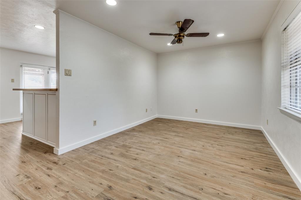 1230 Fairdale Street Irving, TX 75062 - Photo 22 of 24 Empty room with ornamental molding, light wood-type flooring, recessed lighting, and ceiling fan