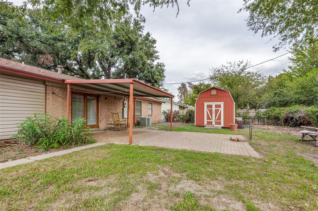 1230 Fairdale Street Irving, TX 75062 - Photo 24 of 24 View of yard featuring a patio area and a shed
