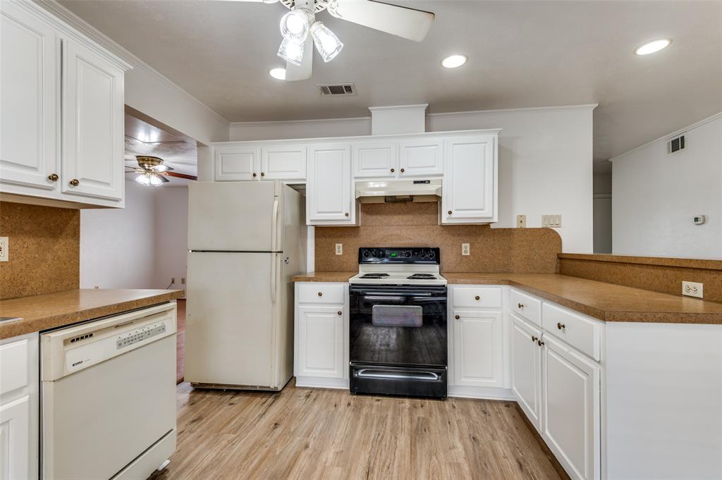 1230 Fairdale Street Irving, TX 75062 - Photo 7 of 24 Kitchen with ceiling fan, white appliances, backsplash, light wood-type flooring, and recessed lighting