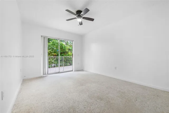 a view of a livingroom with a ceiling fan and window