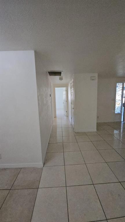 4208 8th St Court East Bradenton, FL 34208 - Photo 15 of 33 a view of a livingroom with an empty space and a windows cabinet