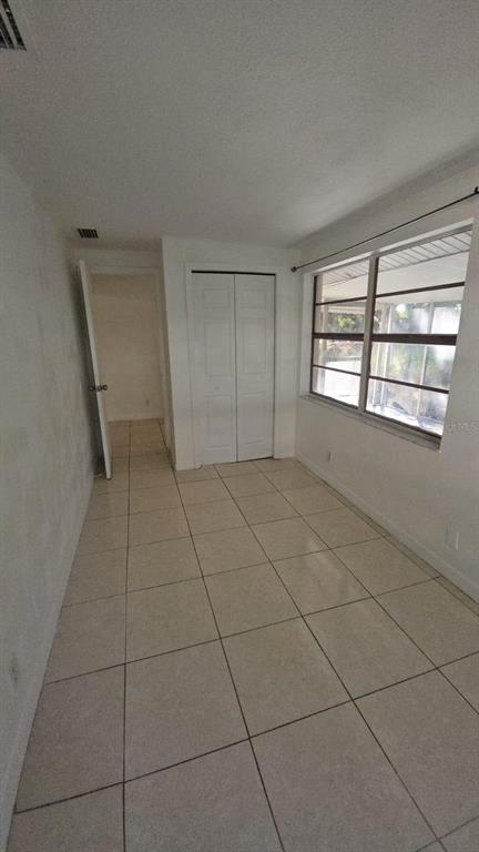 4208 8th St Court East Bradenton, FL 34208 - Photo 29 of 33 a view of an empty room with a window
