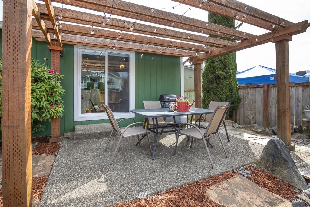 1119 Merea Lane Sultan, WA 98294 - Photo 17 of 20 a view of a dining room with a table and chairs in patio