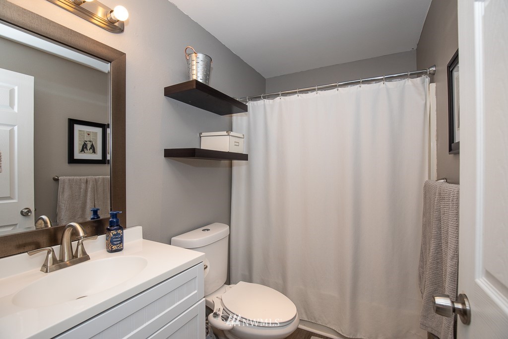1119 Merea Lane Sultan, WA 98294 - Photo 10 of 20 a bathroom with a sink vanity mirror and toilet