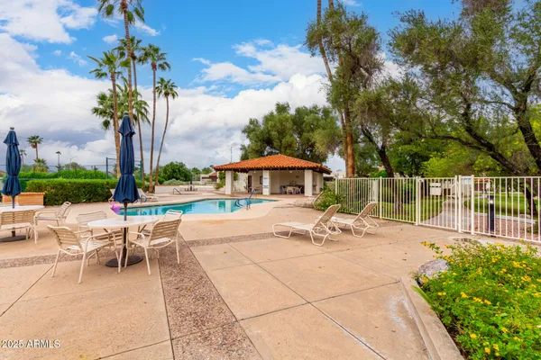 a view of a swimming pool with a patio