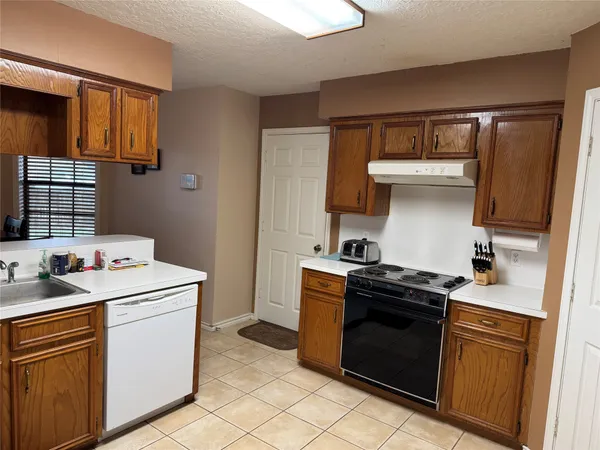 a kitchen with a stove and a sink