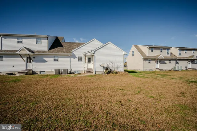 a view of a large house with backyard