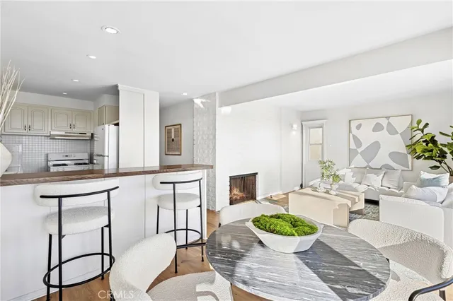 a kitchen with a table and chairs