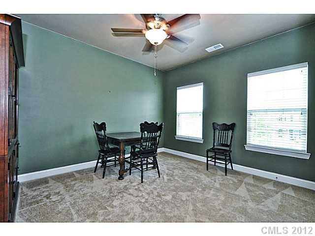 265 Lorraine Road, Unit 15 Fort Mill, SC 29708 - Photo 11 of 16 a view of a dining room with furniture and a chandelier
