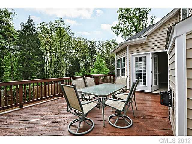 265 Lorraine Road, Unit 15 Fort Mill, SC 29708 - Photo 15 of 16 a view of a chair and table on the deck
