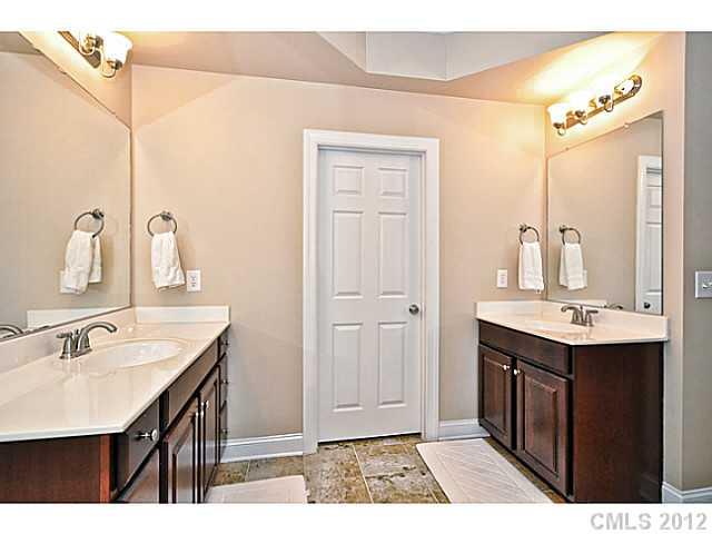 265 Lorraine Road, Unit 15 Fort Mill, SC 29708 - Photo 7 of 16 a bathroom with a sink a mirror and a vanity