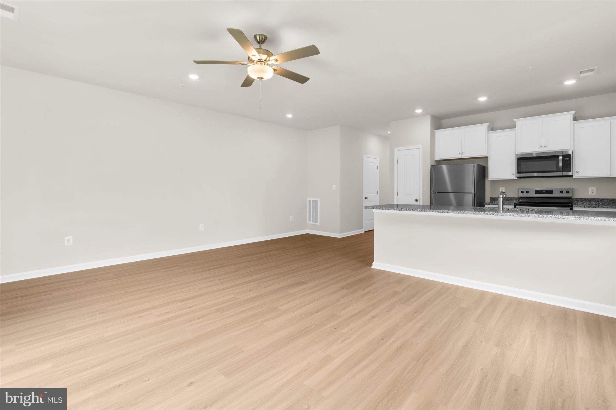 8120 Bartholomew Court Baltimore, MD 21206 - Photo 25 of 47 Dining Room, Living Room & Kitchen