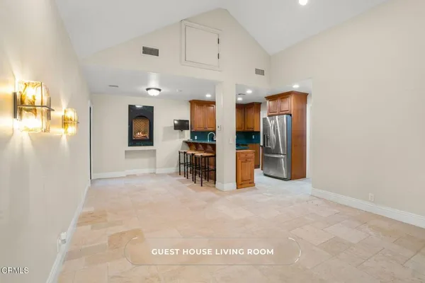 a kitchen with granite countertop stainless steel appliances a stove sink and microwave