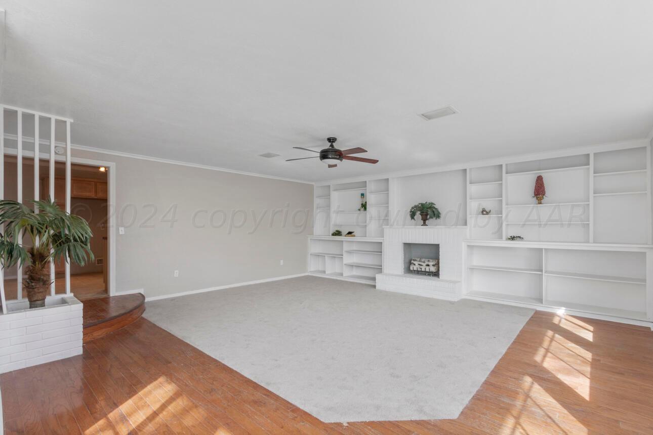 1026 Sunset Terrace Amarillo, TX 79106 - Photo 23 of 44 a living room with furniture and wooden floor