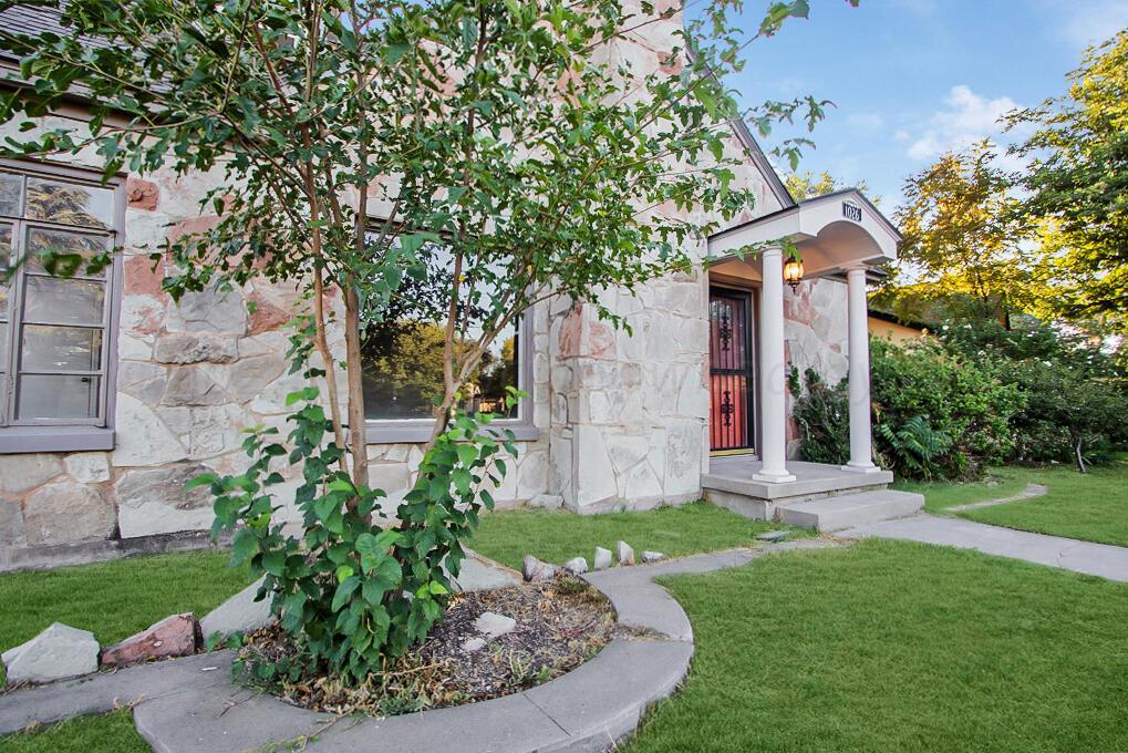 1026 Sunset Terrace Amarillo, TX 79106 - Photo 3 of 44 a view of a house with a small yard and a large tree