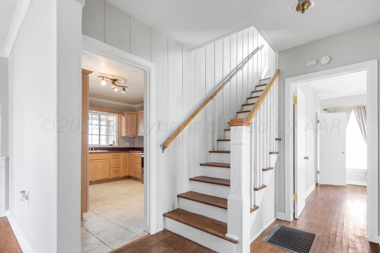 1026 Sunset Terrace Amarillo, TX 79106 - Photo 9 of 44 a view of entryway and hall with wooden floor