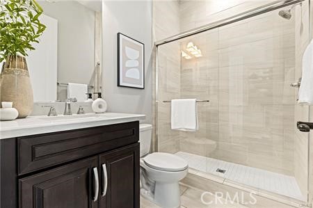 51 Dunmore Irvine, CA 92620 - Photo 9 of 23 a bathroom with a sink vanity mirror and toilet