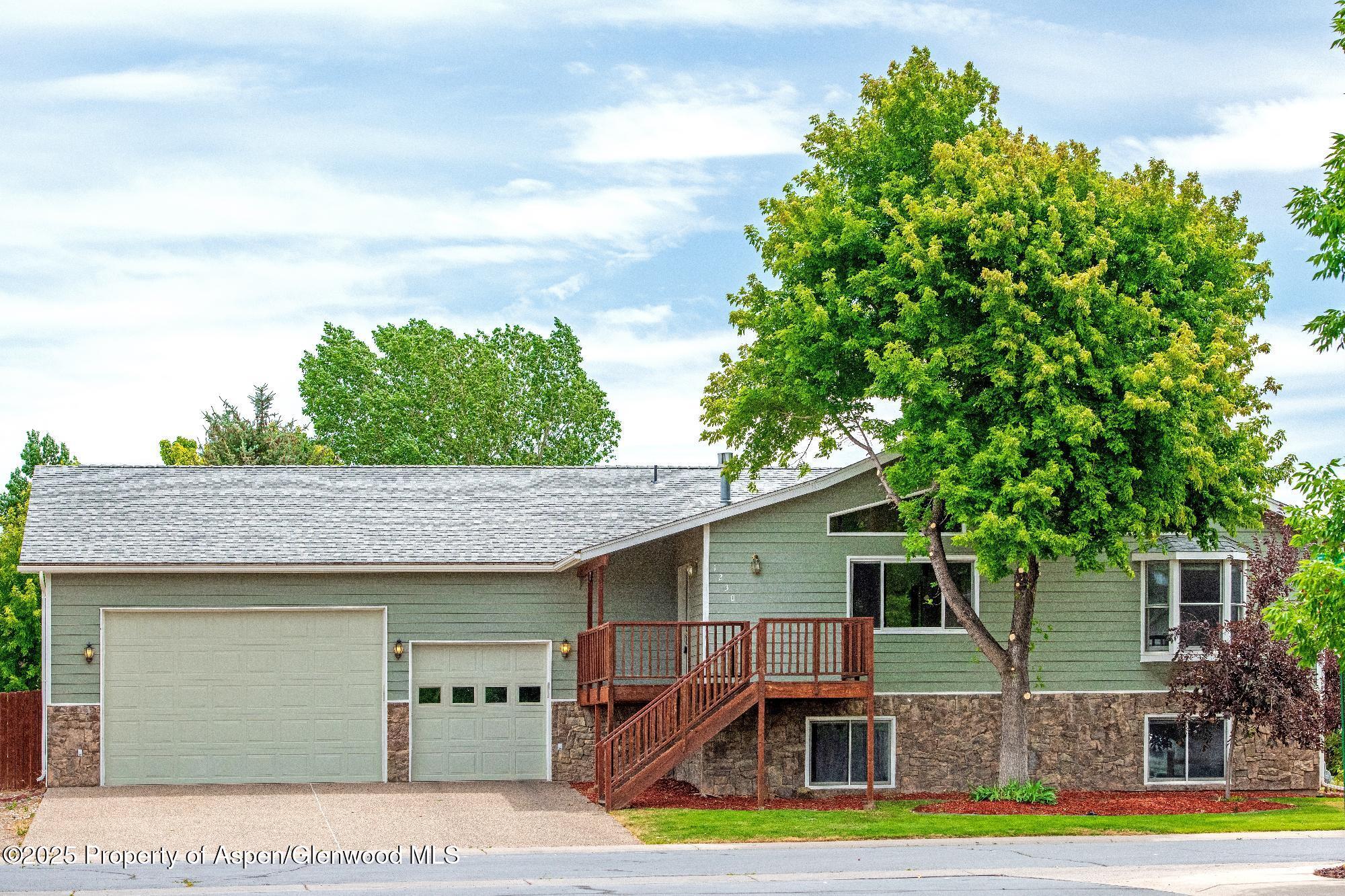 1230 Fir Avenue Rifle, CO 81650 - Photo 1 of 34 a view of backyard with swimming pool and seating space