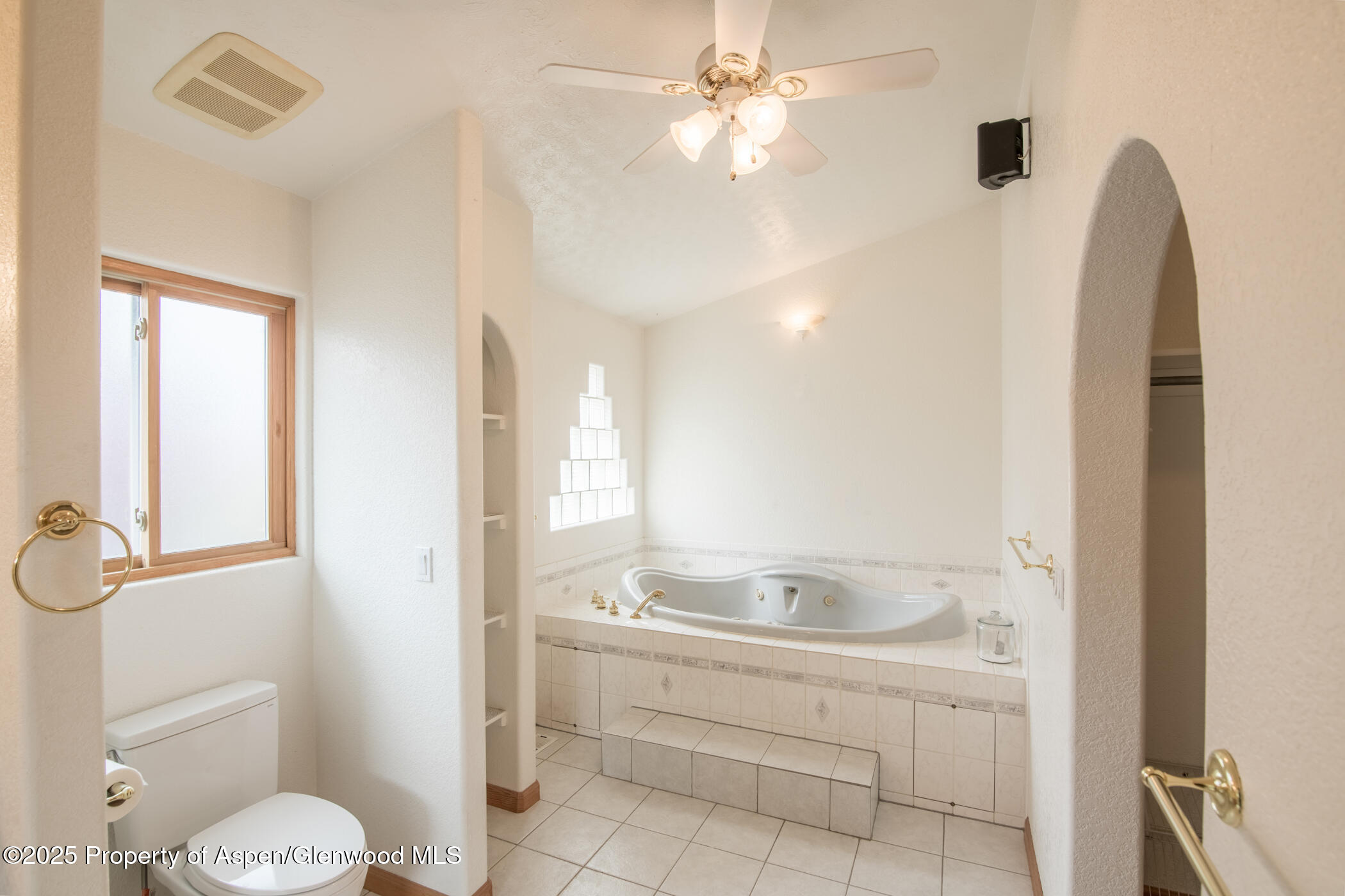1230 Fir Avenue Rifle, CO 81650 - Photo 17 of 34 a bathroom with a sink a toilet and shower