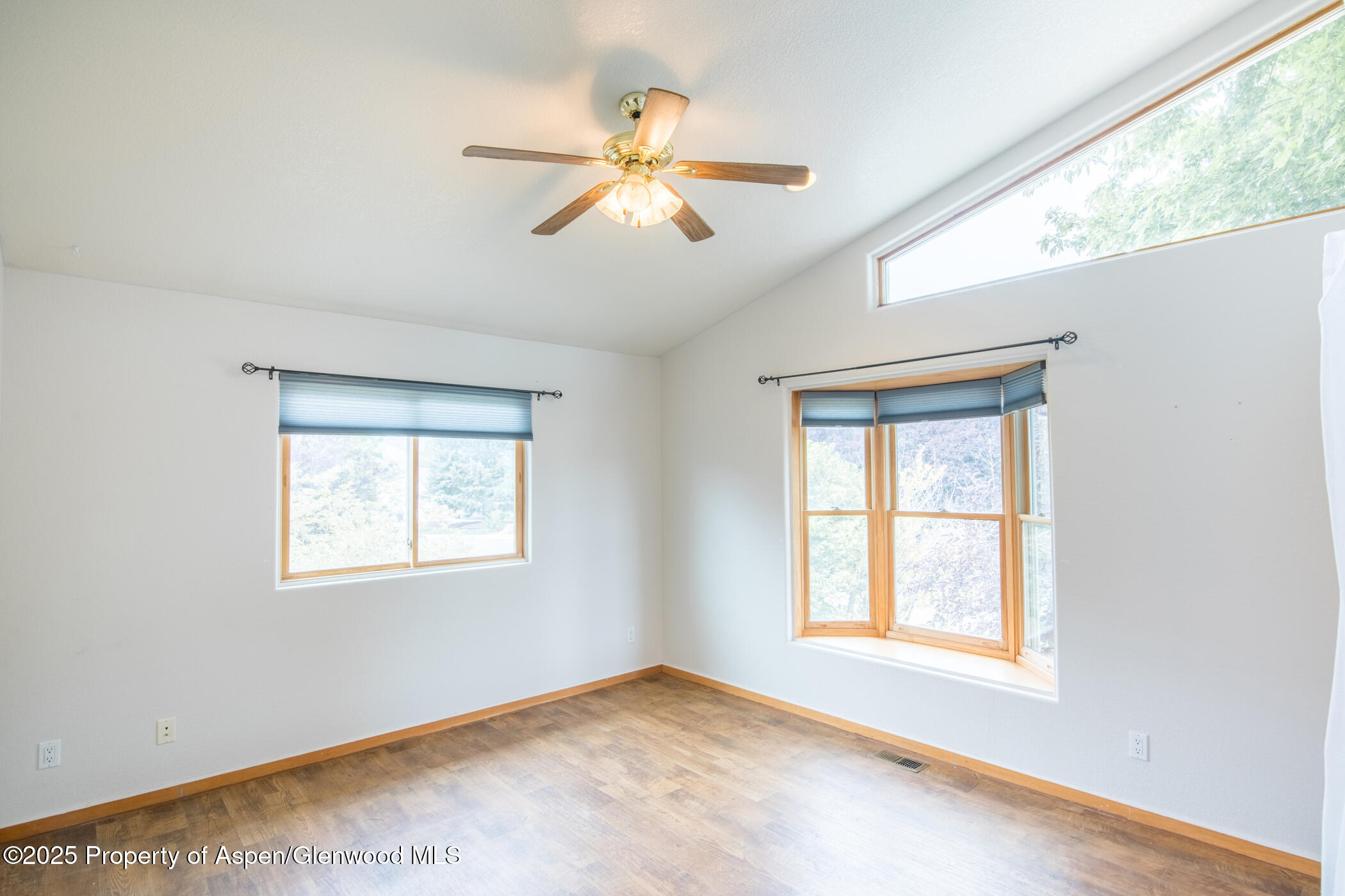 1230 Fir Avenue Rifle, CO 81650 - Photo 19 of 34 an empty room with windows and fan