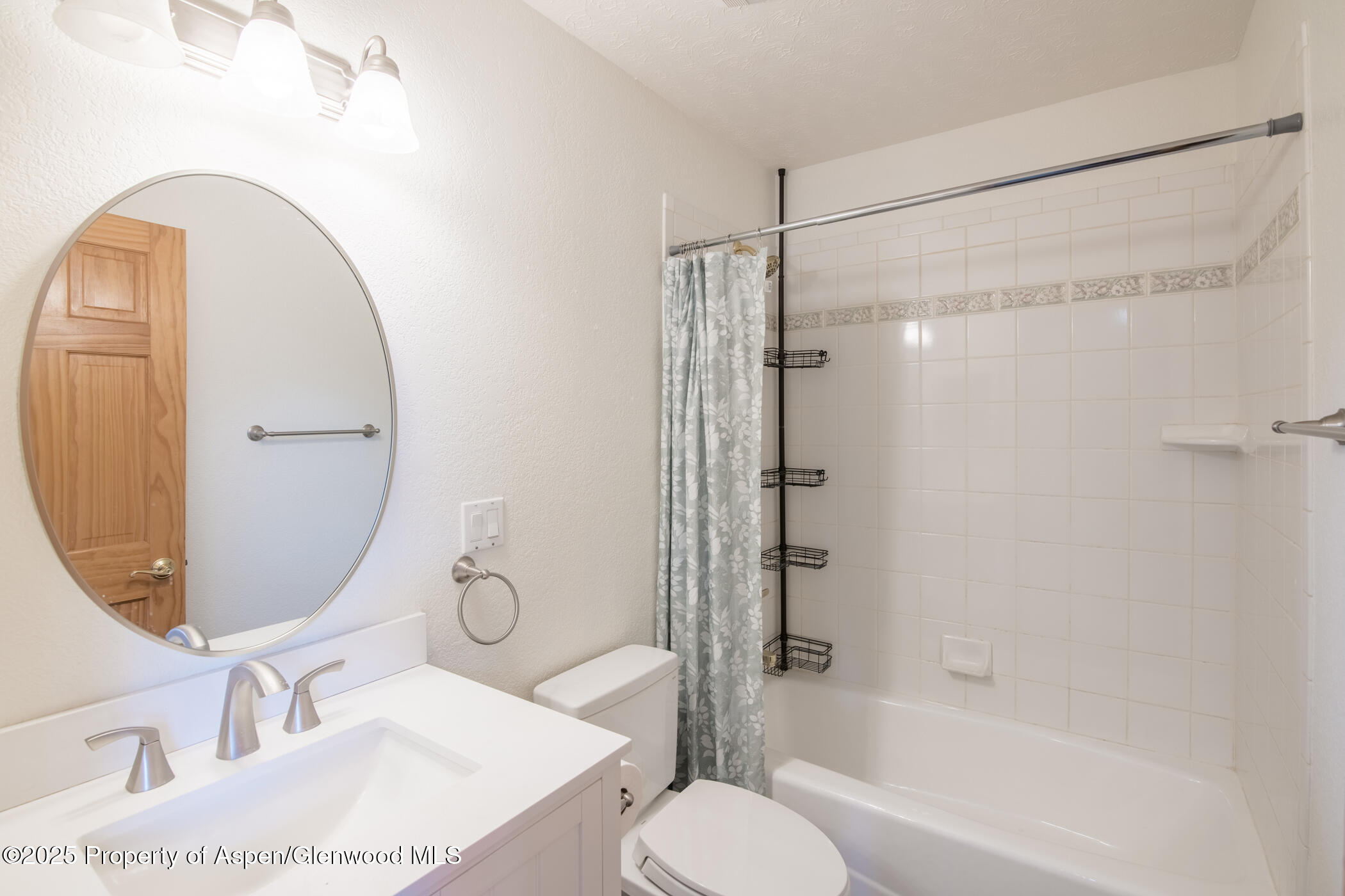 1230 Fir Avenue Rifle, CO 81650 - Photo 20 of 34 a bathroom with a sink toilet and shower