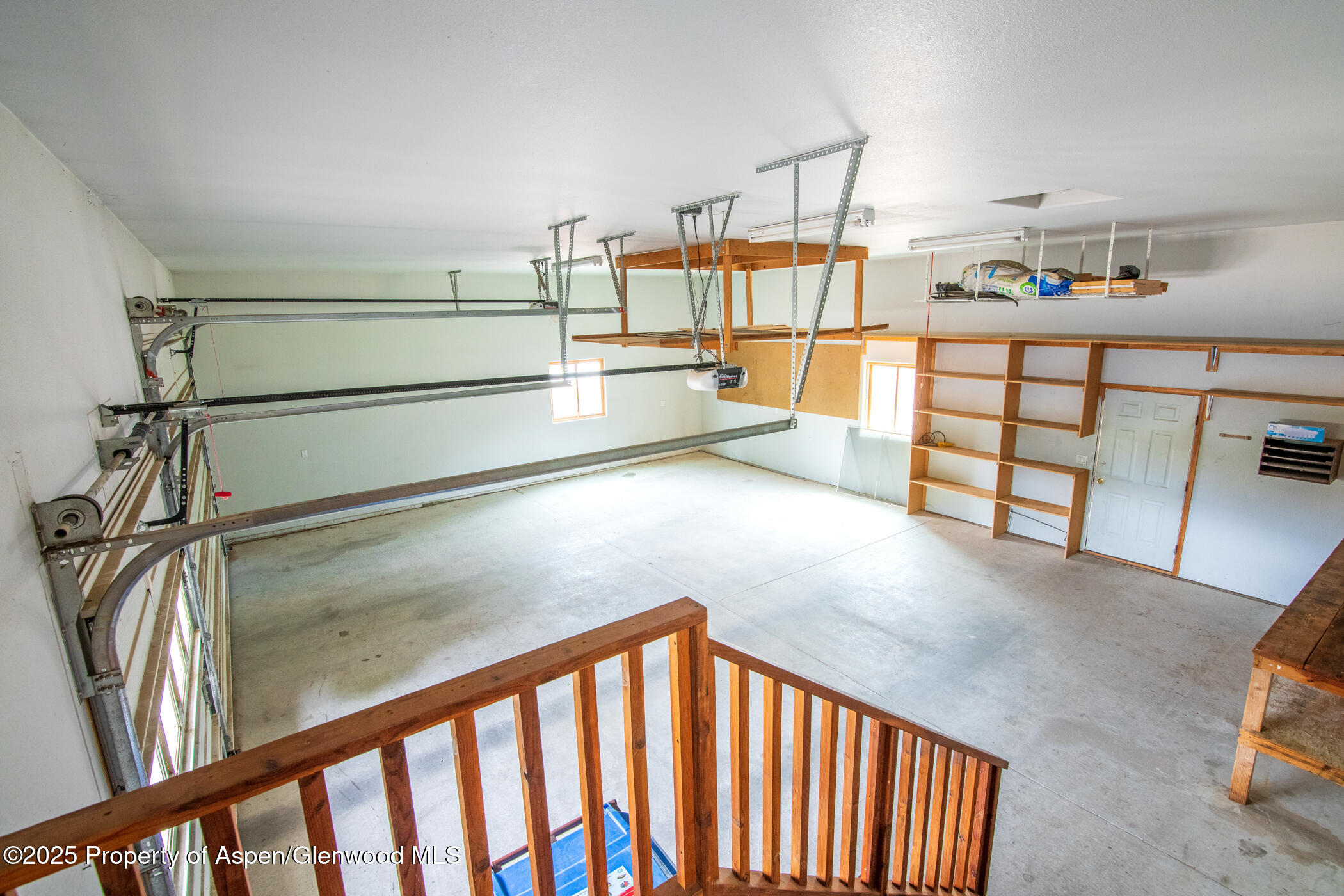 1230 Fir Avenue Rifle, CO 81650 - Photo 31 of 34 a view of a hallway with a dining table and chairs