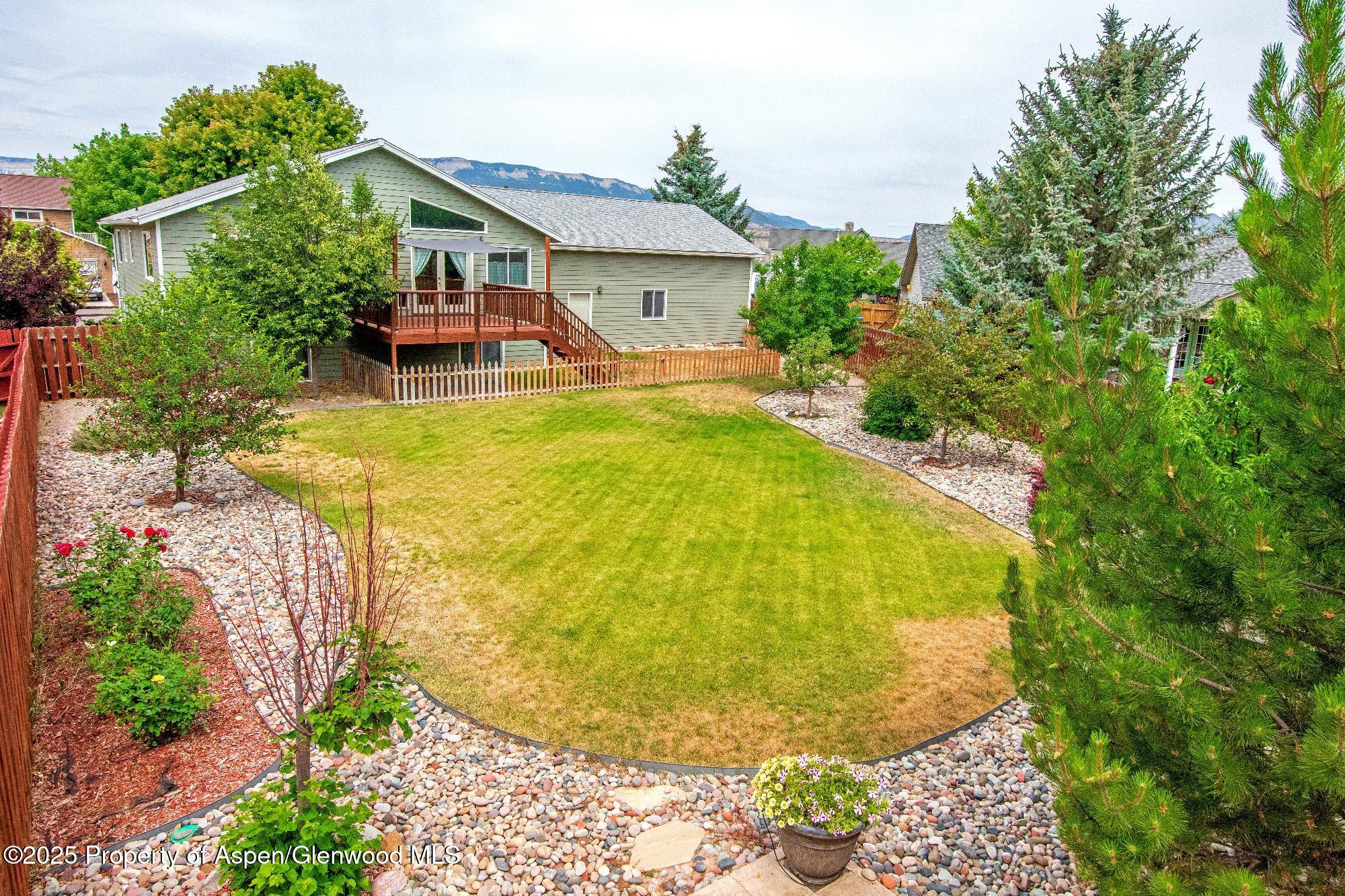 1230 Fir Avenue Rifle, CO 81650 - Photo 4 of 34 a view of a swimming pool and lounge chair