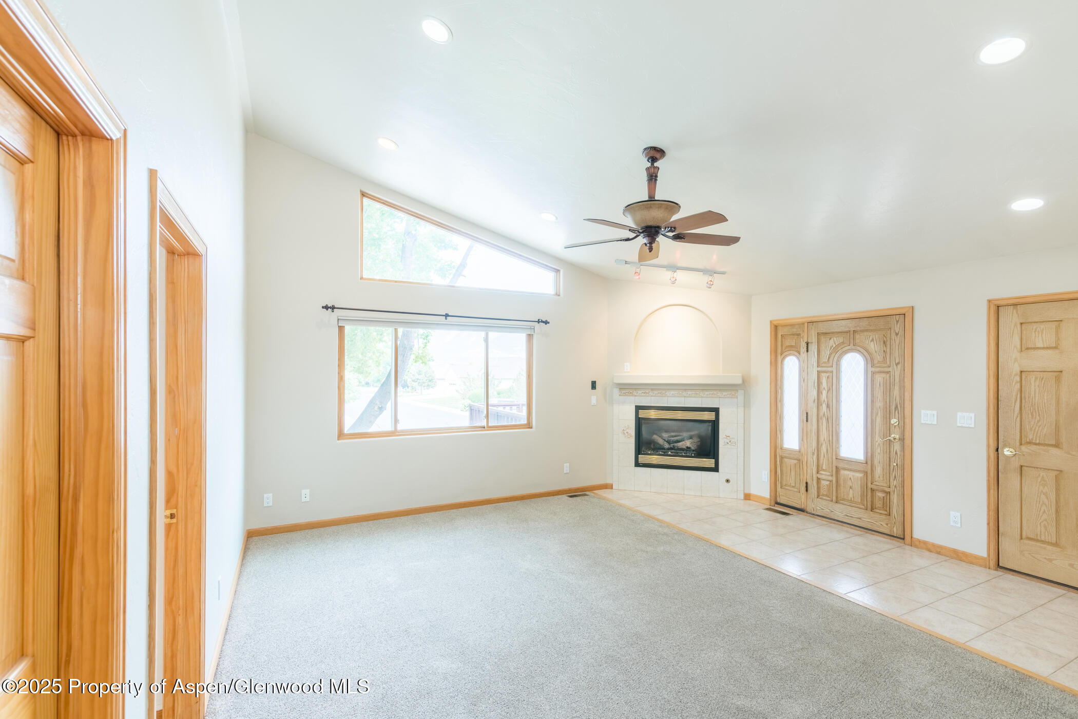 1230 Fir Avenue Rifle, CO 81650 - Photo 8 of 34 a view of livingroom with a fireplace cabinet and windows