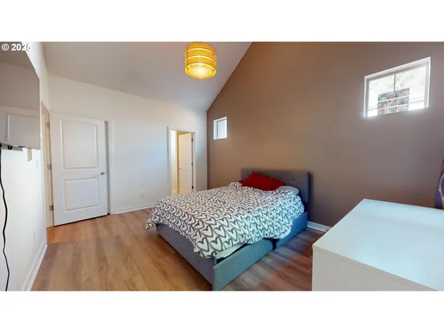a living room with a couch and potted plant