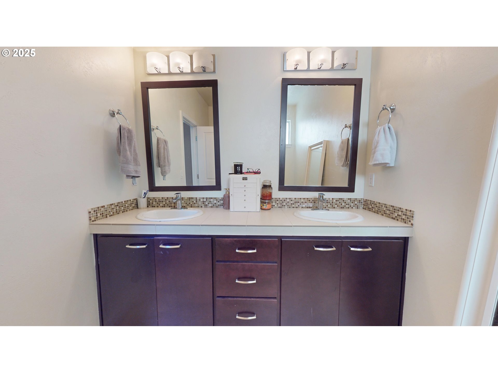 375 Mia Lane Eugene, OR 97401 - Photo 23 of 44 a bathroom with a sink and a mirror