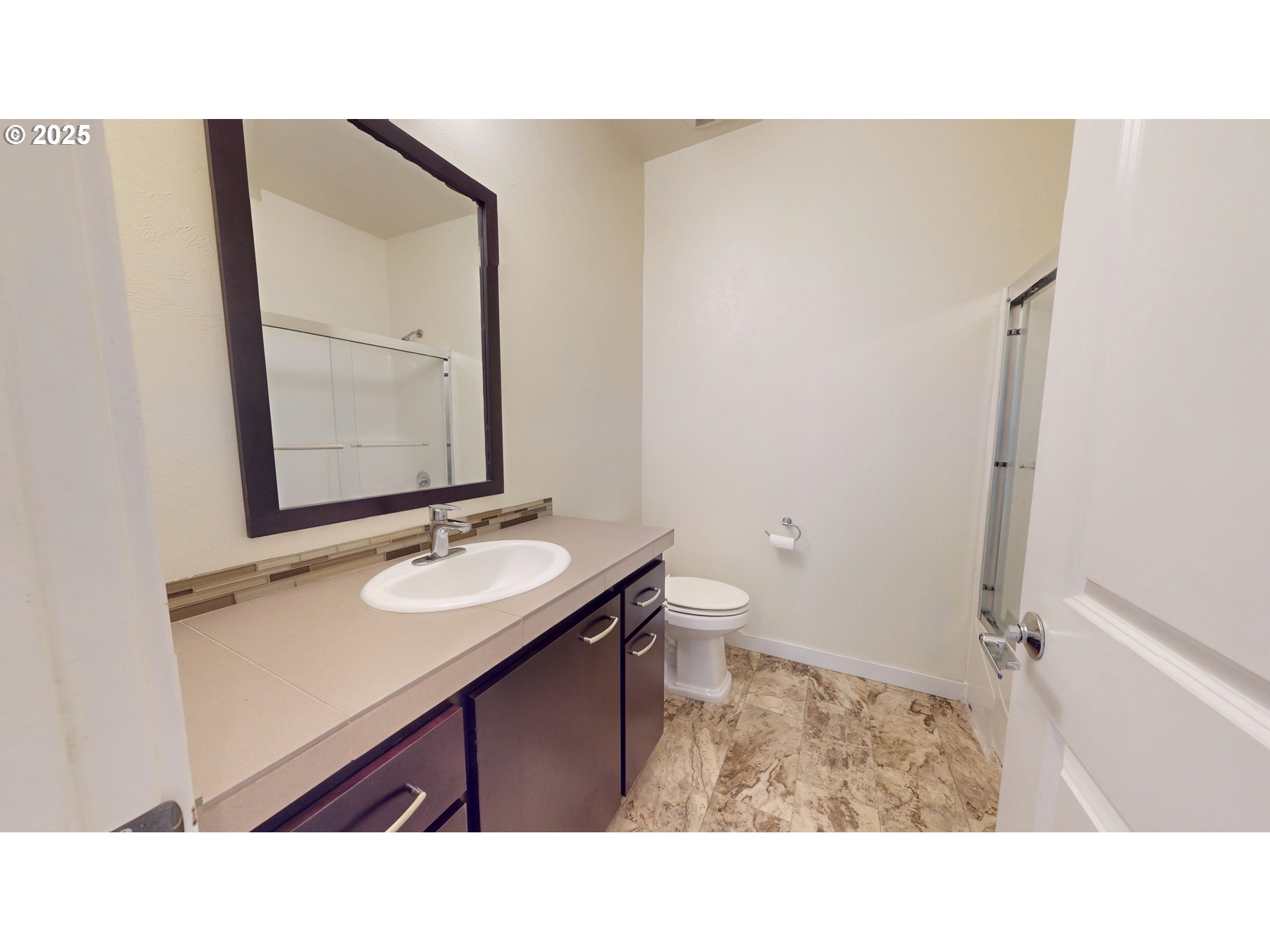 375 Mia Lane Eugene, OR 97401 - Photo 30 of 44 a bathroom with a sink a toilet and mirror