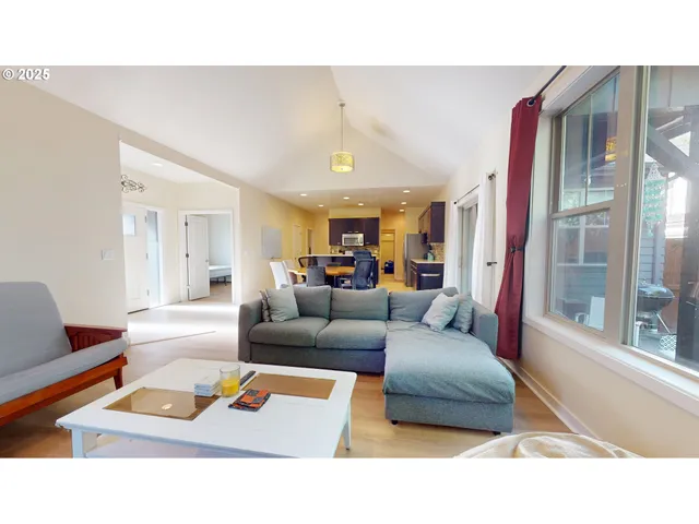 a living room with furniture and a rug
