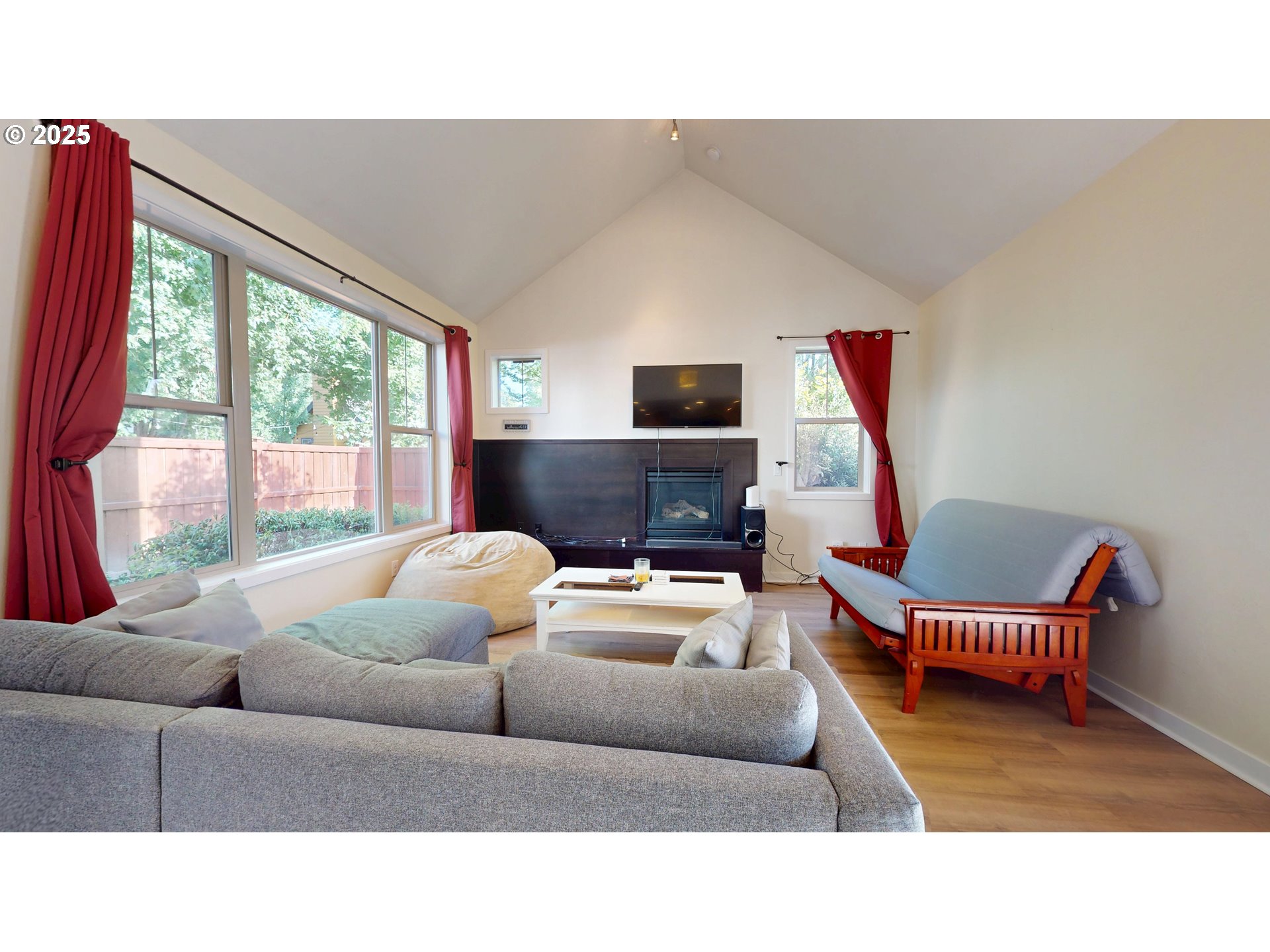 375 Mia Lane Eugene, OR 97401 - Photo 6 of 44 a living room with furniture a flat screen tv and a large window