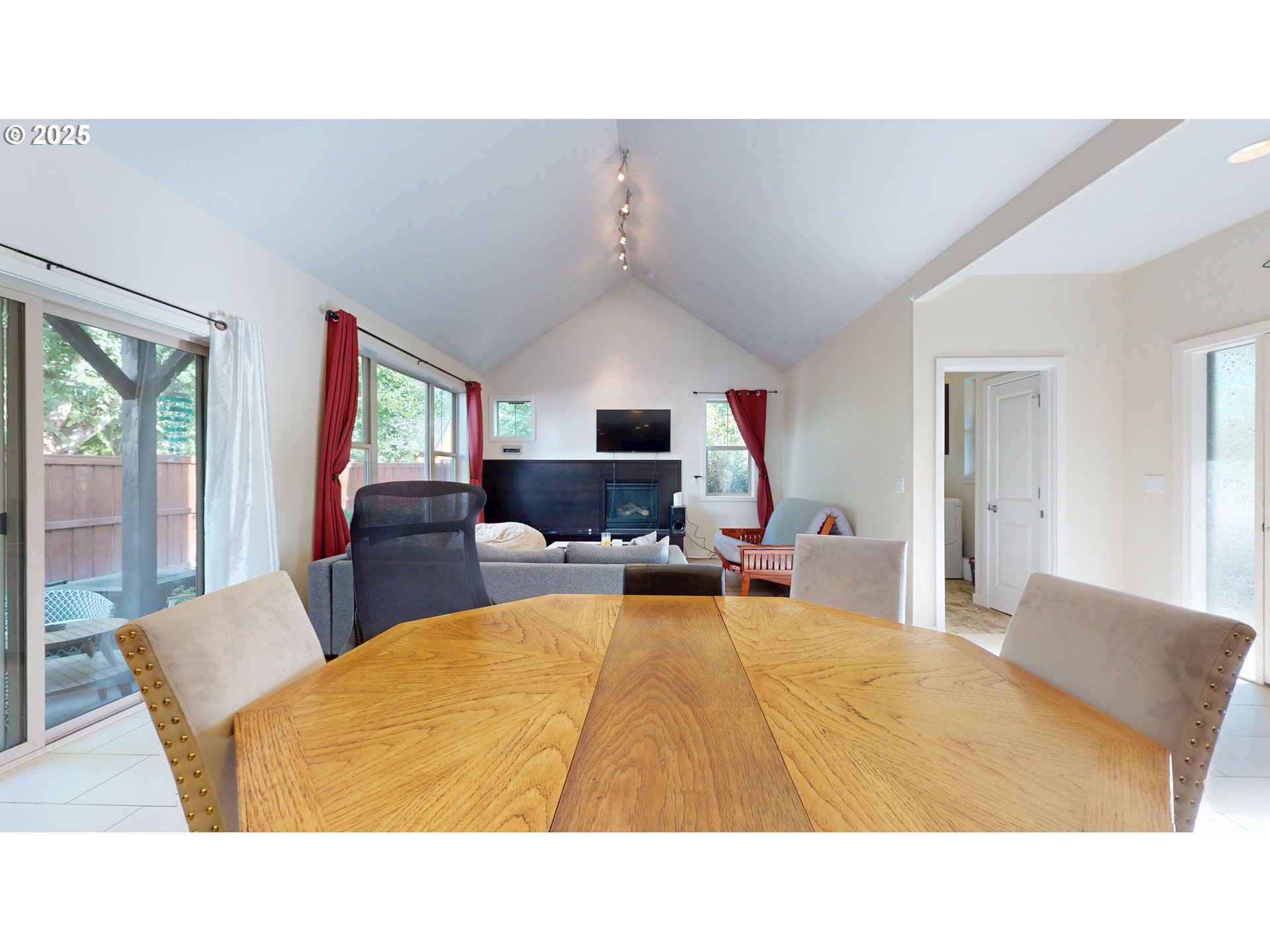 375 Mia Lane Eugene, OR 97401 - Photo 9 of 44 a living room with furniture a flat screen tv and a large window