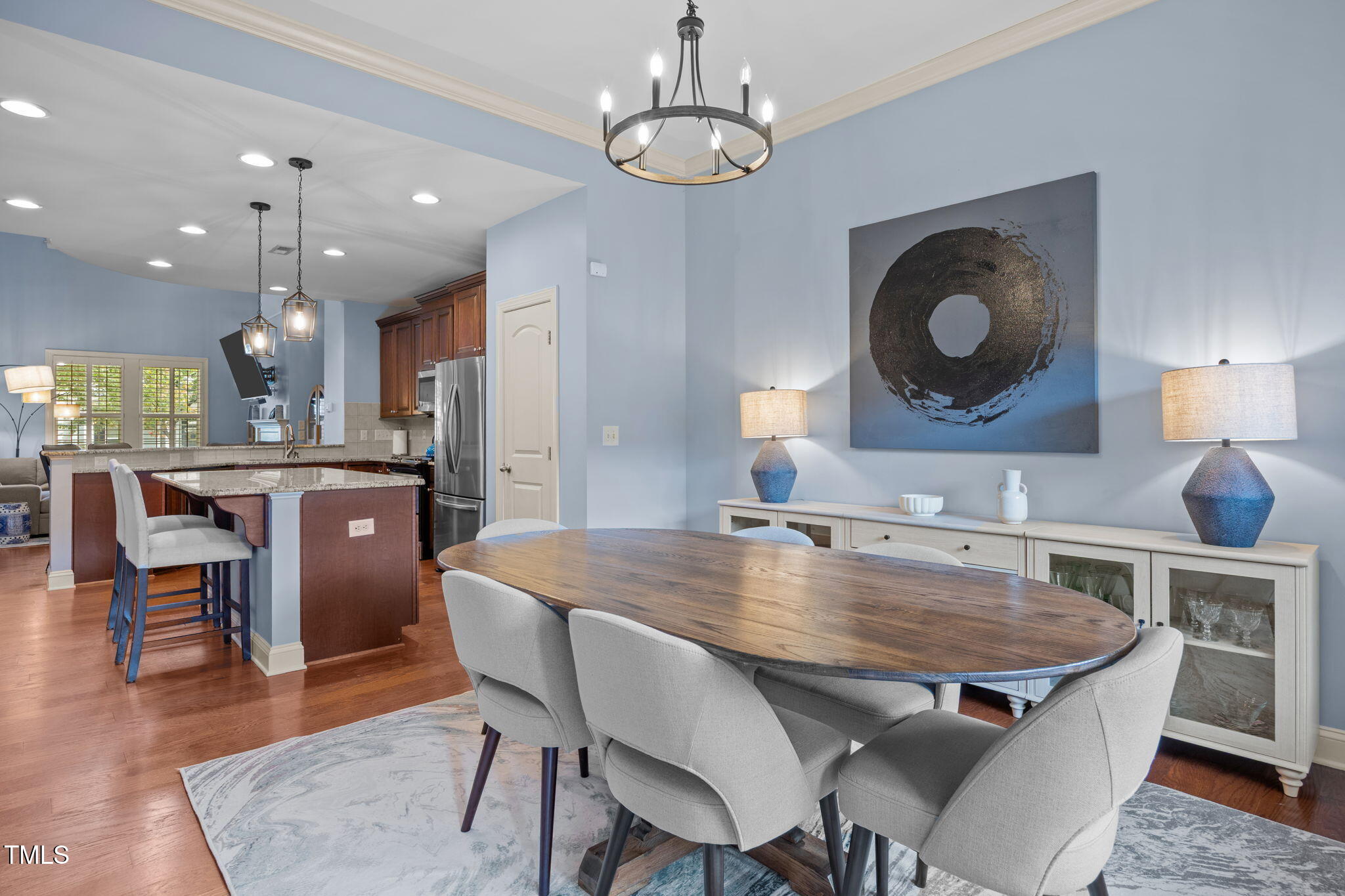 831 Historian Street Raleigh, NC 27603 - Photo 24 of 52 a kitchen with a table and chairs in it