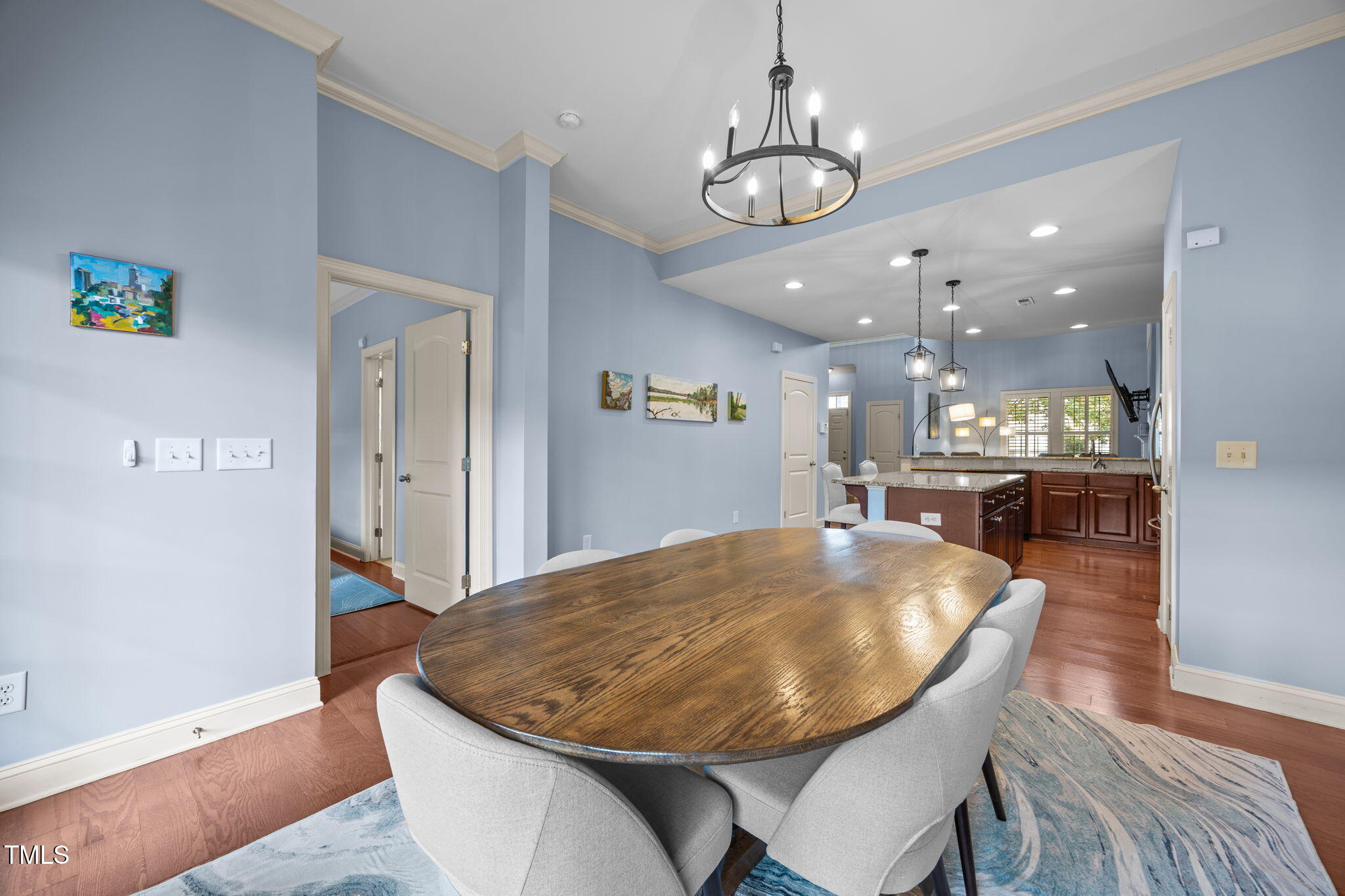 831 Historian Street Raleigh, NC 27603 - Photo 25 of 52 a view of a dining room with furniture and wooden floor